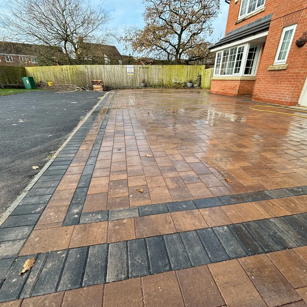 Block paved driveway with a border