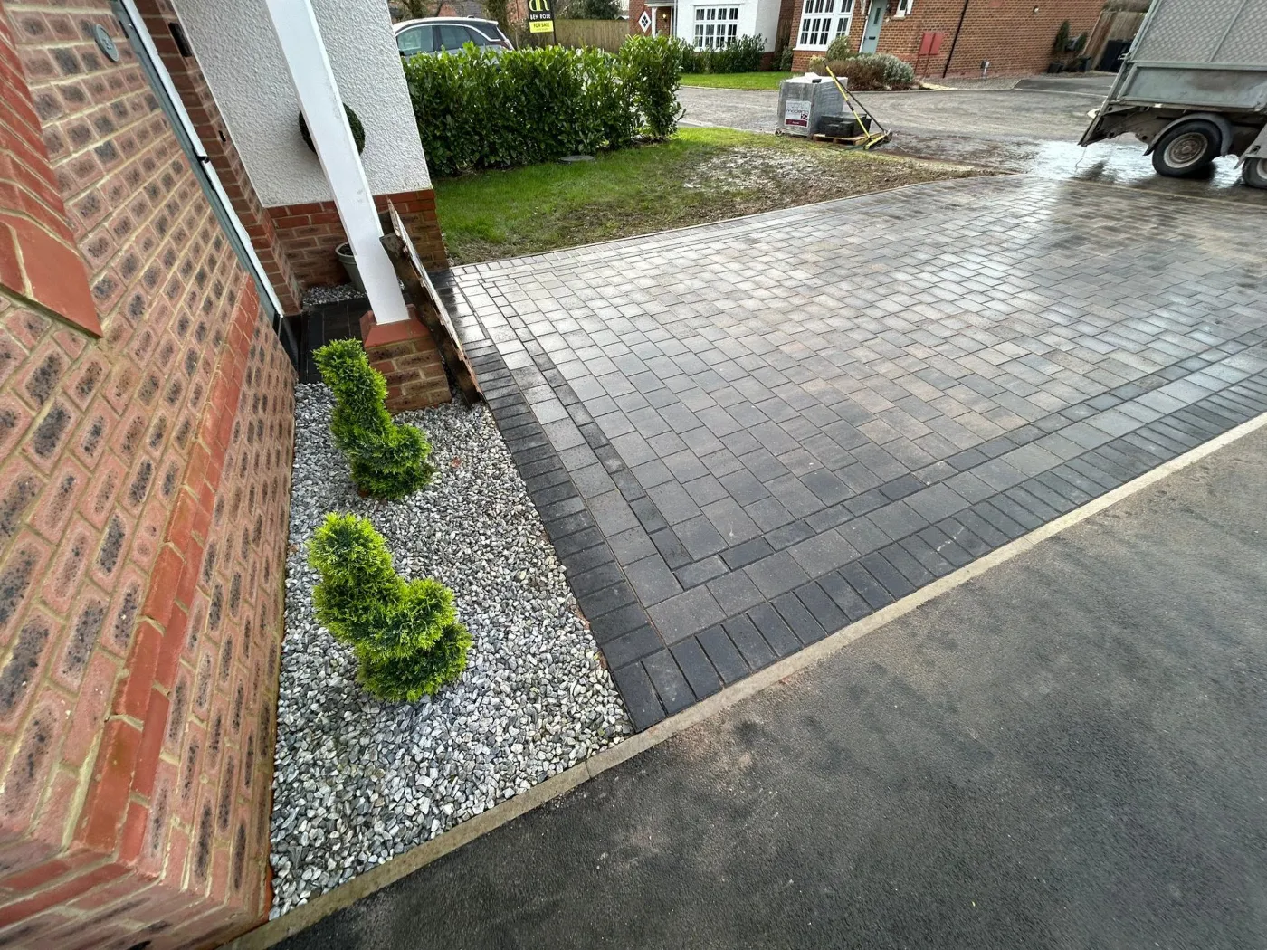 Block paved driveway with a gravel border